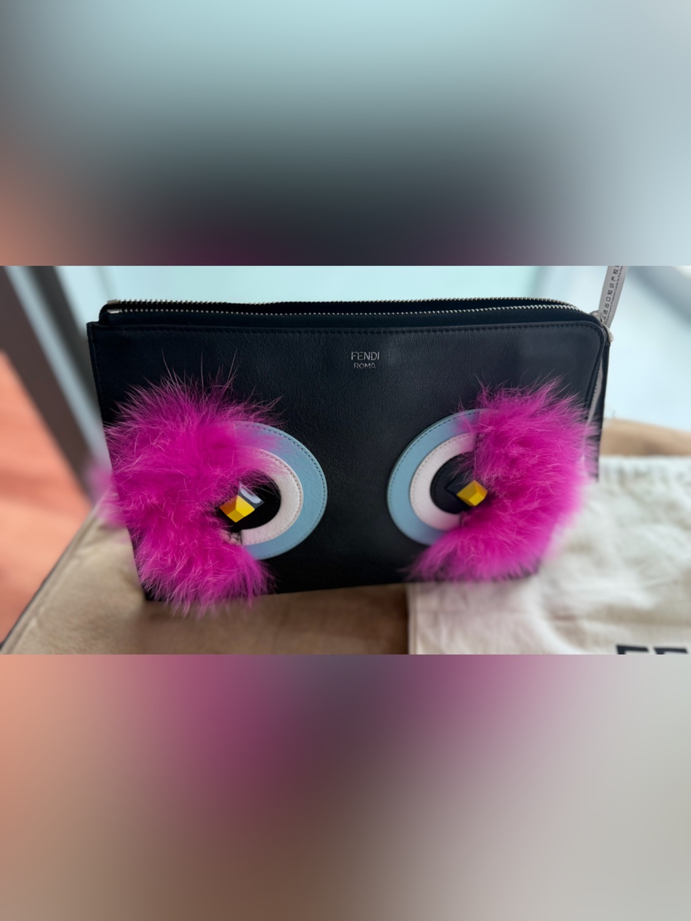 Fendi “Bag Bugs” zip pouch/clutch, featuring the iconic monster eyes